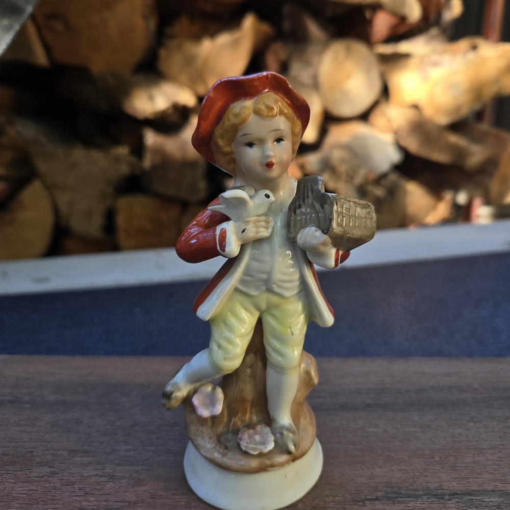 Charming Figurine with Red and Cream Outfit